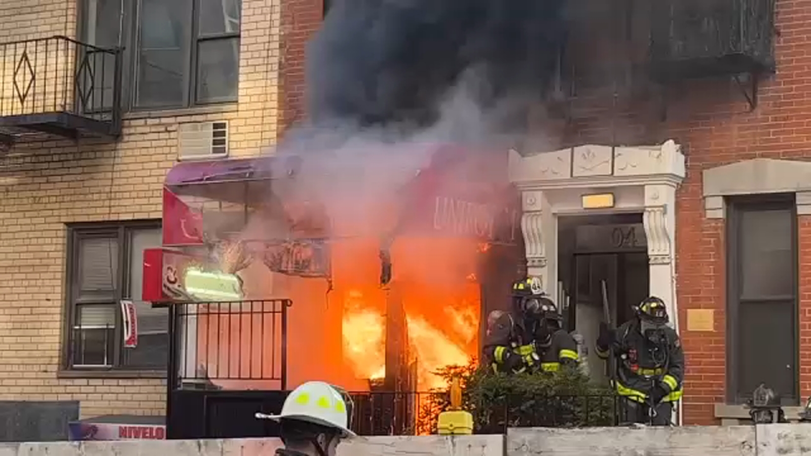 Fire burns through roof of Upper East Side building