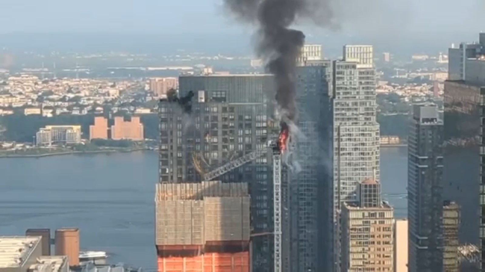 11 injured after burning crane sends debris plummeting to ground below in Manhattan