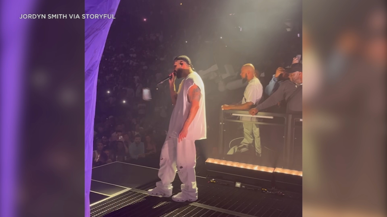 Fan throws cell phone at Drake as he performs on stage, hitting him